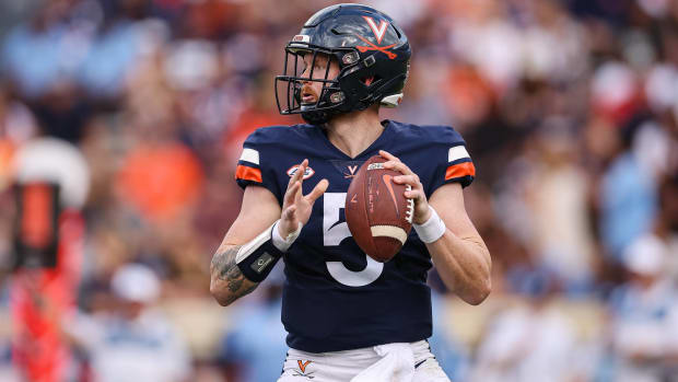 Virginia quarterback Brennan Armstrong drops back to pass in a game vs. North Carolina.